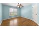 Bright bedroom with a ceiling fan, hardwood floors, and a window with natural light at 3070 Corsair Curv, Cumming, GA 30040