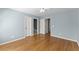 Cozy bedroom with beautiful hardwood floors and access to the bathroom at 3070 Corsair Curv, Cumming, GA 30040