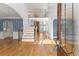 Elegant home foyer with hardwood floors, a staircase, and abundant natural light at 3070 Corsair Curv, Cumming, GA 30040