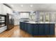 Kitchen featuring white cabinetry, stainless steel appliances, granite countertops, and a center island at 3070 Corsair Curv, Cumming, GA 30040