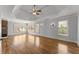 Expansive main bedroom featuring tray ceiling, hardwood floors, and multiple windows at 3070 Corsair Curv, Cumming, GA 30040