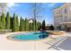 Sparkling pool and hot tub surrounded by lush greenery, offering a private backyard oasis at 3070 Corsair Curv, Cumming, GA 30040