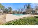 Enjoy this beautiful in-ground pool with manicured landscaping and a poolside structure for shaded seating at 3070 Corsair Curv, Cumming, GA 30040