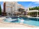 Stunning backyard with a gorgeous swimming pool and an outdoor kitchen area at 3070 Corsair Curv, Cumming, GA 30040