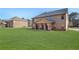Large backyard featuring a covered patio, perfect for outdoor entertaining and enjoying the green space at 7347 Moss Stone Dr, Conyers, GA 30094