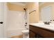 Clean bathroom with a shower-tub combo, tile floors, and simple fixtures at 7347 Moss Stone Dr, Conyers, GA 30094