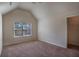 This bedroom has carpet flooring, a window and walk-in closet at 7347 Moss Stone Dr, Conyers, GA 30094