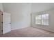 Large bedroom with large window for ample natural light and vaulted ceilings at 7347 Moss Stone Dr, Conyers, GA 30094