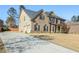 Charming two-story home with a brick and siding exterior, a well-manicured lawn, and a driveway at 7347 Moss Stone Dr, Conyers, GA 30094