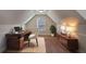 Cozy home office features an A-frame window, a modern desk, and ample storage at 7347 Moss Stone Dr, Conyers, GA 30094