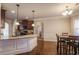 Open-concept kitchen with granite countertops, hardwood floors, breakfast bar, and eat in dining at 7347 Moss Stone Dr, Conyers, GA 30094