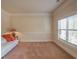 Bright living room with a comfortable white couch and a large window for natural light at 7347 Moss Stone Dr, Conyers, GA 30094