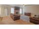 Inviting living room with a stone fireplace, comfortable seating and lots of light at 7347 Moss Stone Dr, Conyers, GA 30094