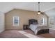 Spacious main bedroom with a comfortable bed, a ceiling fan, and lots of light at 7347 Moss Stone Dr, Conyers, GA 30094