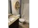 Bathroom featuring granite vanity, shower with seat and elegant neutral accents at 750 Great Oak Pl, Villa Rica, GA 30180