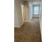 Hallway with neutral carpeting and a window at 750 Great Oak Pl, Villa Rica, GA 30180