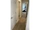 Hallway leading to a bedroom with wood-look flooring at 750 Great Oak Pl, Villa Rica, GA 30180