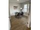 Well-lit home office featuring wood floors, a modern desk, and decorative wall art at 750 Great Oak Pl, Villa Rica, GA 30180