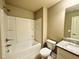 Bathroom featuring a bathtub/shower combo and vanity with granite countertop and tile flooring at 125 Honey Creek Rd, Conyers, GA 30094