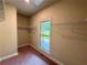 Walk-in closet with neutral paint, shelving and a window offering a view of the outdoors at 125 Honey Creek Rd, Conyers, GA 30094