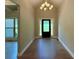 Welcoming foyer with hardwood floors, chandelier lighting, and a view of the front door at 125 Honey Creek Rd, Conyers, GA 30094