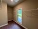 Spacious walk-in closet with window and shelving provides ample storage for an organized wardrobe at 125 Honey Creek Rd, Conyers, GA 30094