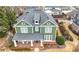 Aerial view of a beautiful two-story home with a well-maintained lawn at 174 Kelly St, Norcross, GA 30071