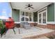 Covered patio featuring outdoor seating and a red grill at 174 Kelly St, Norcross, GA 30071