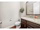 Elegant powder room with granite countertop and decorative wreath at 174 Kelly St, Norcross, GA 30071