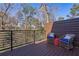 Outdoor balcony with wicker chairs and forested views at 2323 Mason Dr # D21, Atlanta, GA 30316