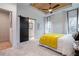 Bedroom featuring gray carpet, wooden ceiling, barn door to bathroom, and a glimpse of the closet space at 2323 Mason Dr # D21, Atlanta, GA 30316