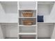 Neatly organized closet with white shelving, rods, and storage baskets, enhancing functionality and aesthetic at 2323 Mason Dr # D21, Atlanta, GA 30316