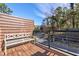 Outdoor patio with bench overlooking the tree-lined street at 2323 Mason Dr # D21, Atlanta, GA 30316