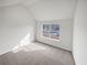 Bright main bedroom featuring a large window and plush carpeting at 545 Zoie Ln, Palmetto, GA 30268