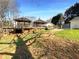 Expansive backyard featuring a large deck with gazebo, offering ample space for outdoor entertaining and relaxation at 1750 Elizabeth Sw Ct, Conyers, GA 30094