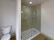 Updated bathroom featuring a walk-in shower with a glass door and handicap grab bar at 1750 Elizabeth Sw Ct, Conyers, GA 30094