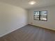 Bedroom showcasing neutral carpet, baseboard trim and a window at 1750 Elizabeth Sw Ct, Conyers, GA 30094