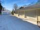 Exterior view of the home with a three-car garage and additional garage at 1750 Elizabeth Sw Ct, Conyers, GA 30094