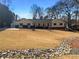 Traditional home featuring a sprawling front yard and covered entryway, a perfect blend of comfort and curb appeal at 1750 Elizabeth Sw Ct, Conyers, GA 30094