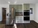 Kitchen with stainless steel appliances, grey cabinets, and granite counters offers a modern design at 1750 Elizabeth Sw Ct, Conyers, GA 30094