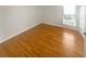 Cozy bedroom with hardwood floors and a bright window at 1832 Glenwood Ln, Snellville, GA 30078