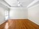 Room features hardwood floors, ample natural light, and neutral walls at 1832 Glenwood Ln, Snellville, GA 30078