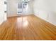 Bright dining room with hardwood floors, elegant trim, and natural light from large windows at 1832 Glenwood Ln, Snellville, GA 30078