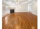 Open living room with a cozy fireplace, hardwood floors, and ample natural light for comfortable living at 1832 Glenwood Ln, Snellville, GA 30078
