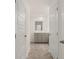 Bathroom featuring a tiled floor, vanity with sink, and white doors at 464 Reflection Dr # 22, Stockbridge, GA 30281