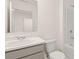 Bathroom with white marble countertop, brushed nickel faucet, and bathtub with shower at 464 Reflection Dr # 22, Stockbridge, GA 30281