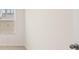 Bright bedroom features neutral walls and carpet, and a window providing natural light at 464 Reflection Dr # 22, Stockbridge, GA 30281