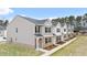 Charming townhome exterior with gray siding, brick accents, and well-maintained landscaping at 464 Reflection Dr # 22, Stockbridge, GA 30281