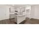 Bright kitchen features granite countertops, stainless appliances and a functional center island at 464 Reflection Dr # 22, Stockbridge, GA 30281