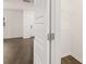 View of a white pantry with wire shelves, located off a kitchen with hardwood flooring at 464 Reflection Dr # 22, Stockbridge, GA 30281